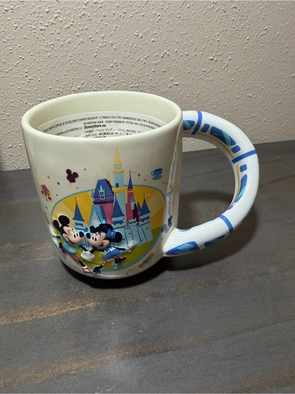 Disney mug w Mickey and Minnie featuring a monorail handle NWT